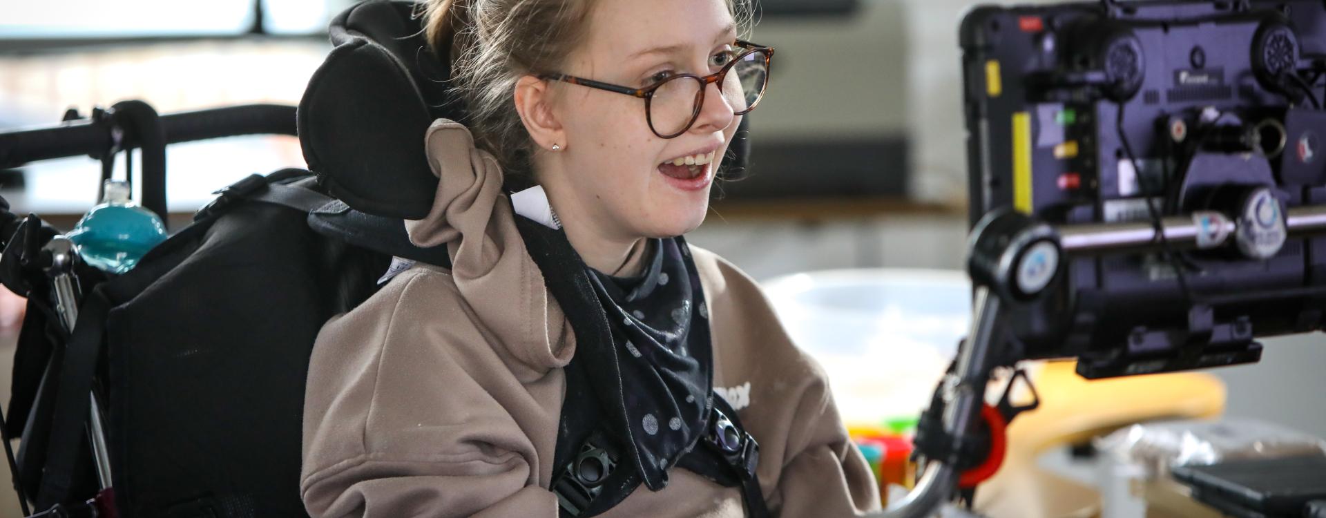 Girl with adaptive technology tablet