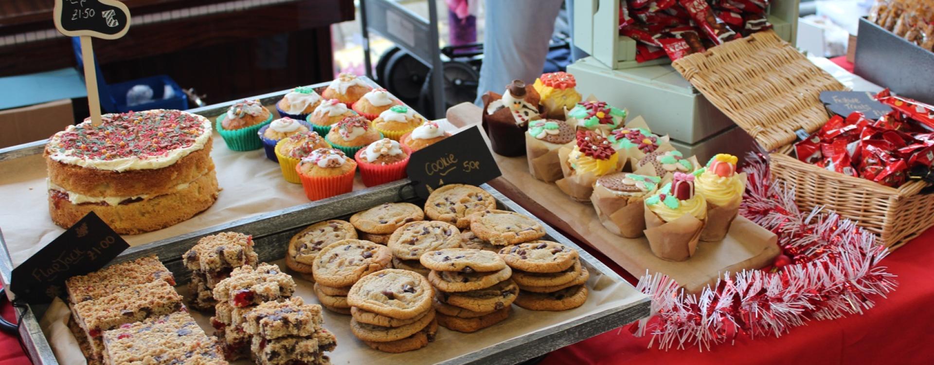 cupcakes, cookies and biscuits laid out for a Cake Sale at Treloar's