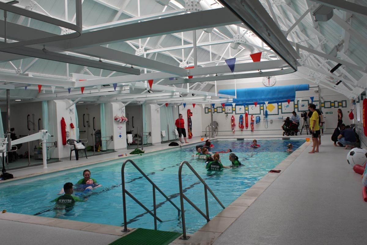 Treloar's swimming pool showing new changing rooms with hoists along the poolside