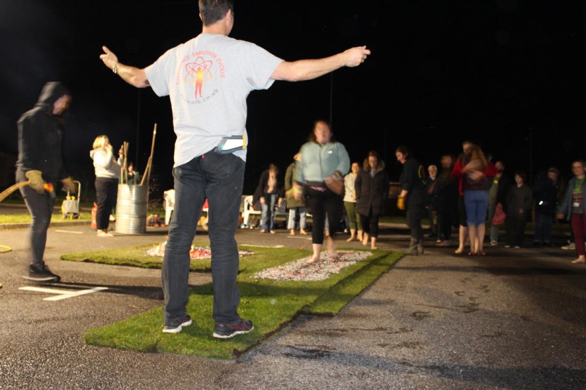 Firewalk participant walking on coals