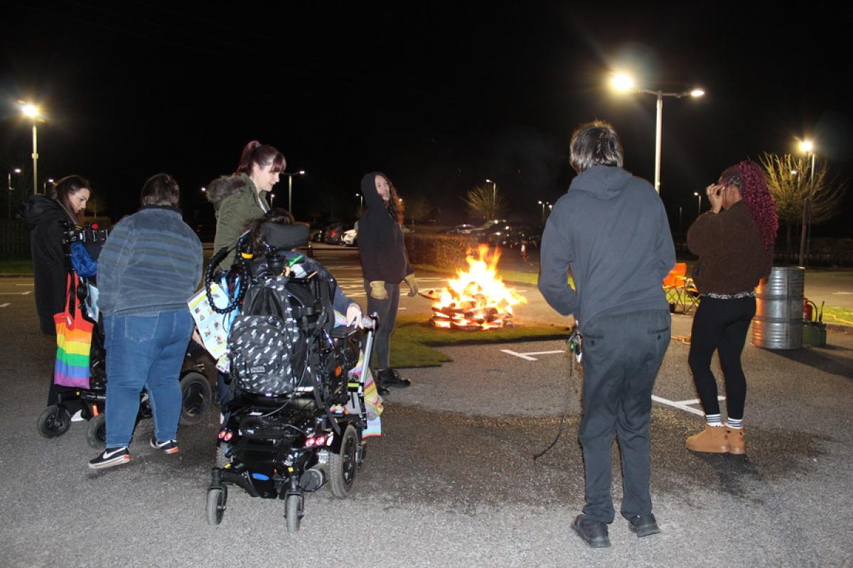 Treloar's students and staff watching the Firewalk set up