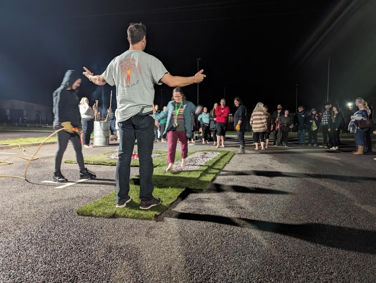 Firewalk participant walking on coals