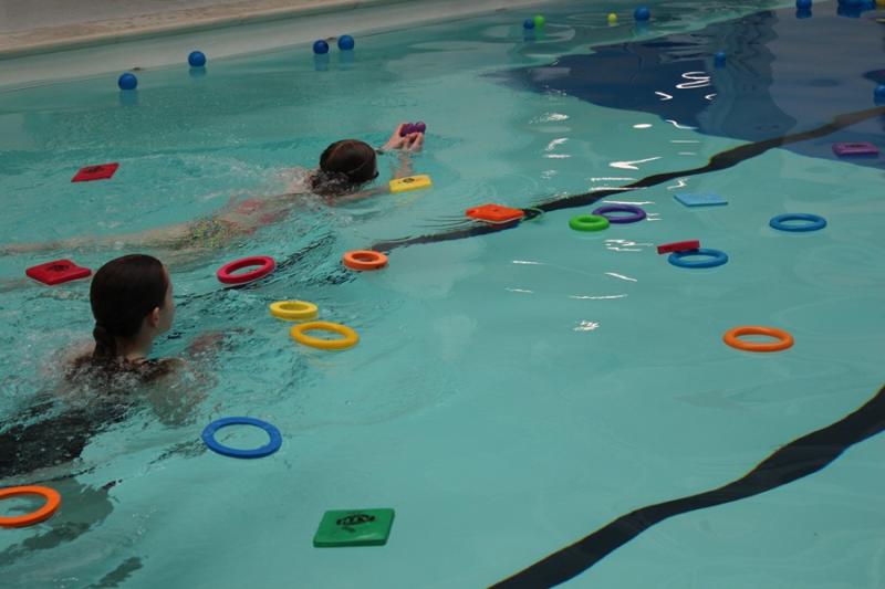 Day of Disability Sports at Treloar's: students in the pool fishing out plastic balls and hoops.