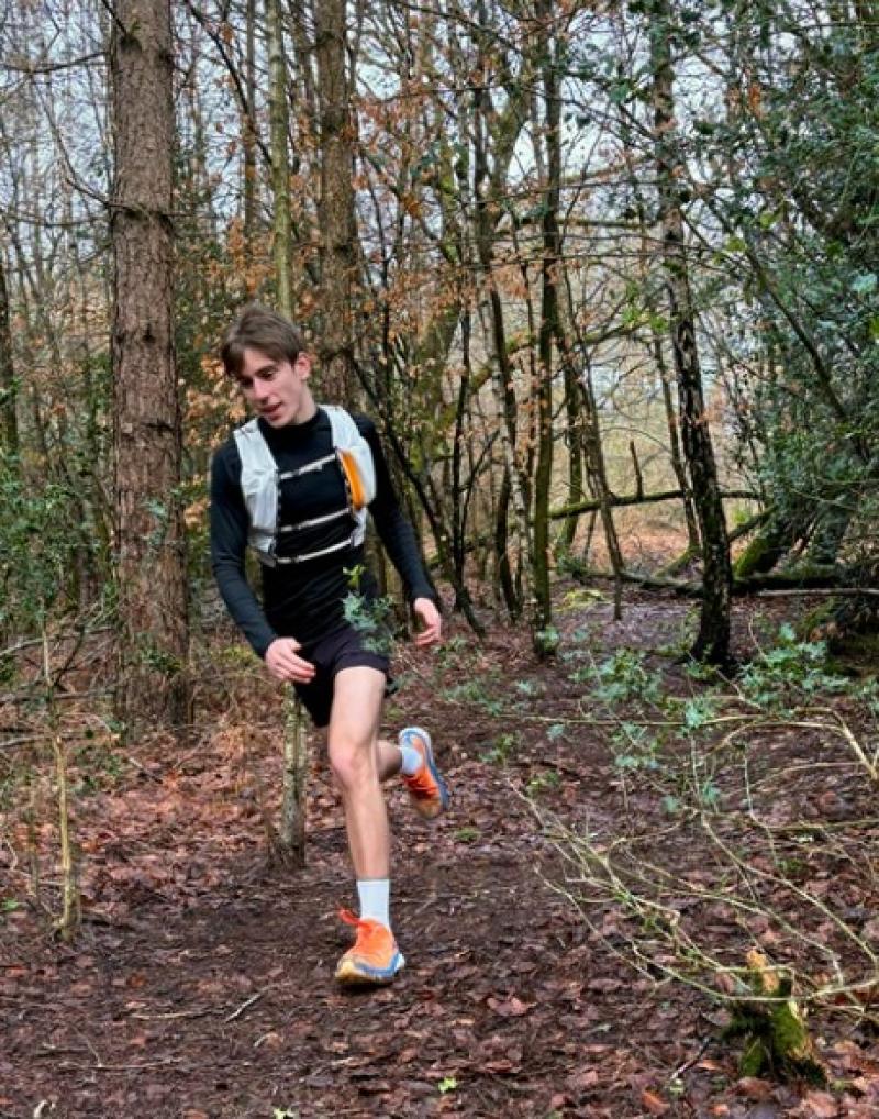 Treloar's student support assistant Tivon running in the woods, training for the London marathon.