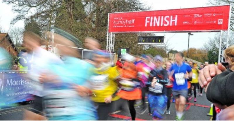 Crowd of people at the finish line running - everyone is blurred.