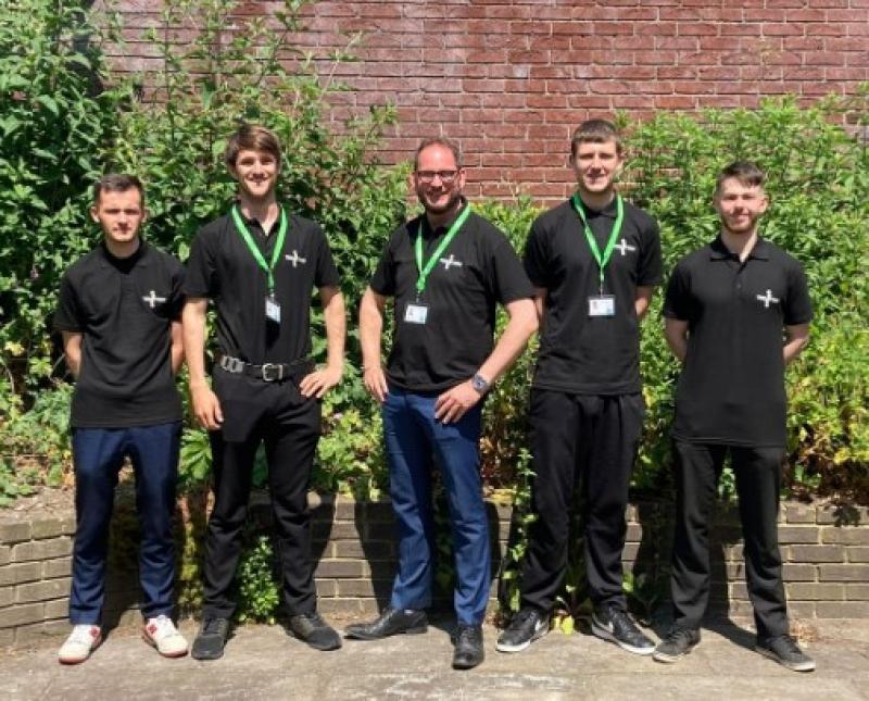 TRELOTTERY canvassing team group photo: 5 men all wearing black T-shirts.