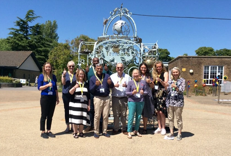 Group photo of Makaton trustees with Treloar's Speech and Language team members taken outside and everyone is showing thumbs up.