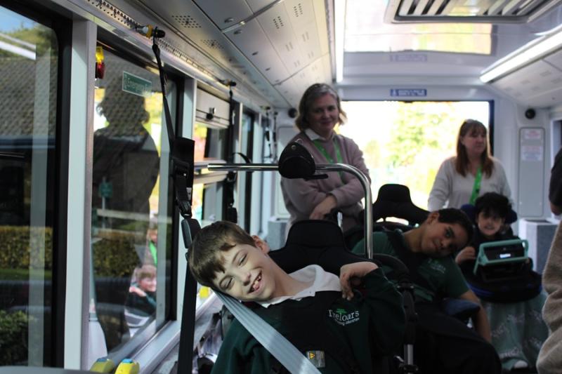 Treloar's students on a new electric bus with staff - all excited to be on it for the first time.