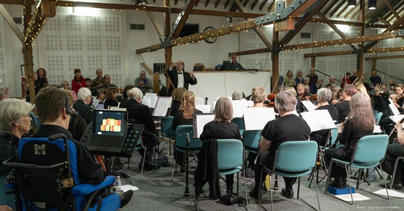 A wide shot of Alton Concert Orchestra playing in The Alton Maltings Centre, with Alessandro playing the Clarion