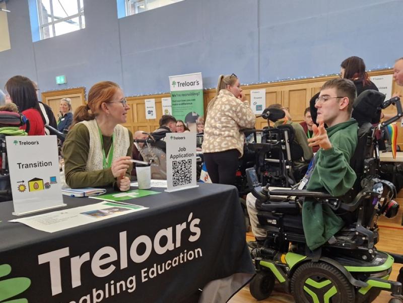 Treloar College student talking to a career adviser at Treloar's during Job Shop event. 