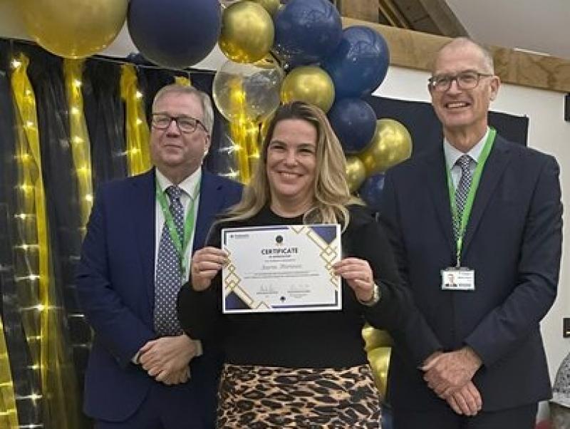 Karen Florence, Employability Coordinator at Treloar's, holding her certificate at the Celebration of Success event.