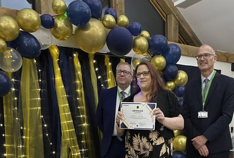 Krissie Young, Treloar's Deputy Team Leader at Gauvain House, holding her certificate at the Celebration of Success event