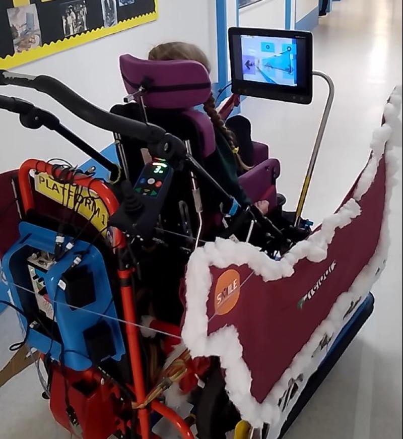 Treloar's student practising her driving skills using one of a DriveDeck decorated as a sleigh.