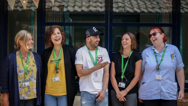 5 members of staff in front of the Treloar's reception