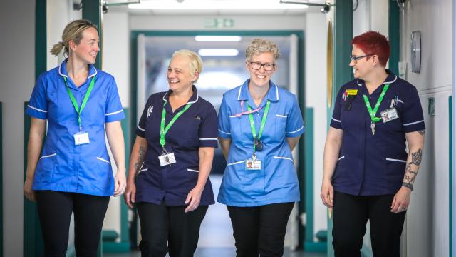 4 members of staff in uniforms