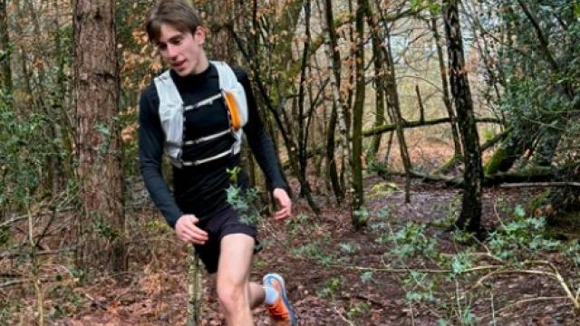 Treloar's student support assistant Tivon running in the woods, training for the London marathon.