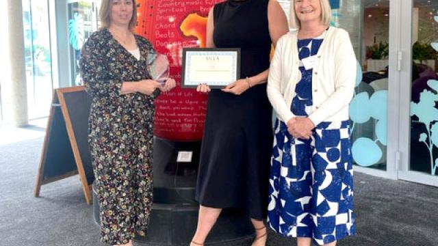 Caroline Weighton, Deputy Head of Speech and Language Therapy at Treloar's,  and Head of School Lisa Bond with the UKLA Award.