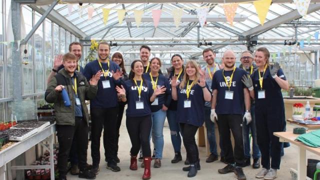 Proud fundraising group in our greenhouse