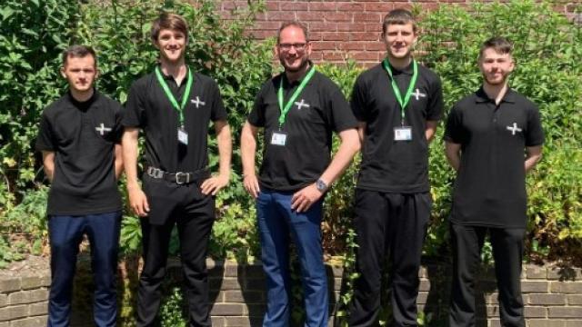 TRELOTTERY canvassing team group photo: 5 men all wearing black T-shirts.