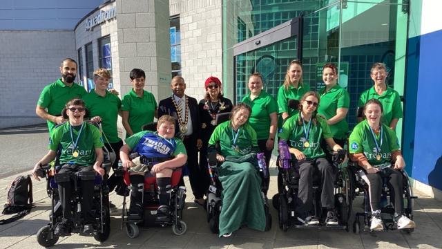 Treloar's Swim Squad posing for a group photo outside with the Mayor of Basingstoke and Deane.