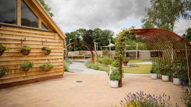 The Outdoor Learning Centre at Treloar's with lavender in bloom and runner beans flowering over the archway