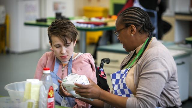 College student cooking during a domestic independence class