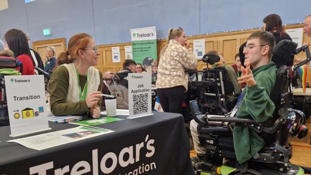 Treloar College student talking to a career adviser at Treloar's during Job Shop event. 