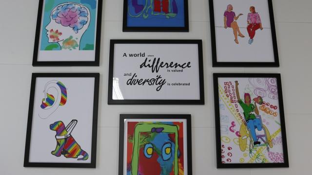 a wall collage of artwork created by Treloar College students.