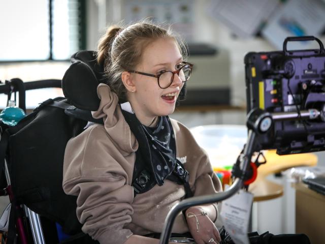 Girl with adaptive technology tablet