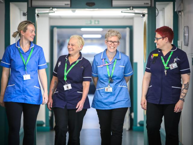 4 members of staff in uniforms