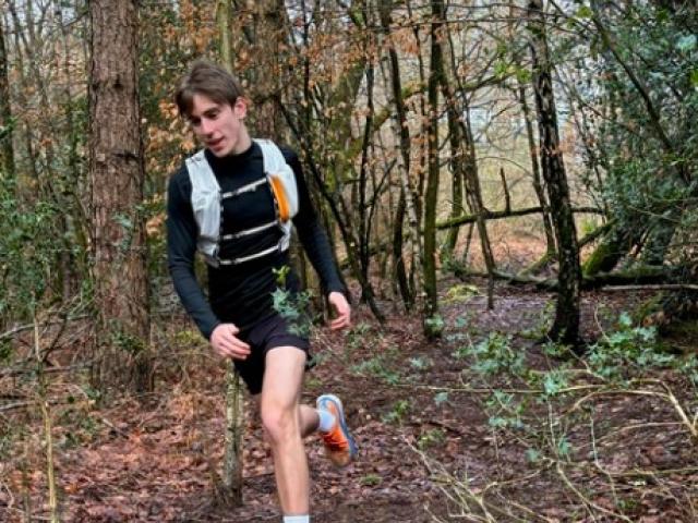 Treloar's student support assistant Tivon running in the woods, training for the London marathon.