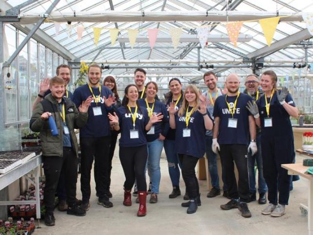 Proud fundraising group in our greenhouse