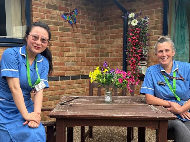 Treloar's nurses Sara and Fiona sit outside one of the residential houses