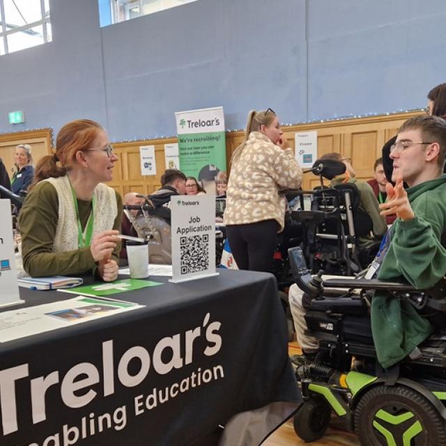 Treloar College student talking to a career adviser at Treloar's during Job Shop event. 