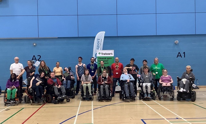 A group photo of Treloar's staff and students at Surrey Sports Park during the Natspec Games