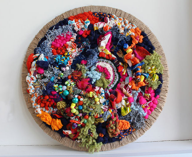 Art exhibition: Art piece made by Treloar's students using fabrics: it's round and full of colours fabrics