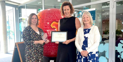 Caroline Weighton, Deputy Head of Speech and Language Therapy at Treloar's,  and Head of School Lisa Bond with the UKLA Award