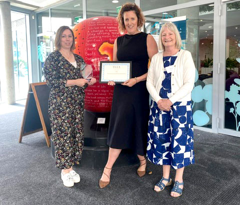 Caroline Weighton, Deputy Head of Speech and Language Therapy at Treloar's,  and Head of School Lisa Bond with the UKLA Award
